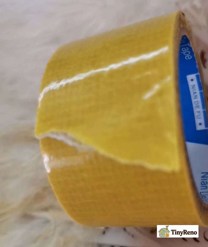 Double-sided tape, very sticky, I regret using it for wallpaper.